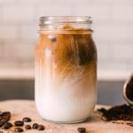 clear glass jar with brown liquid inside