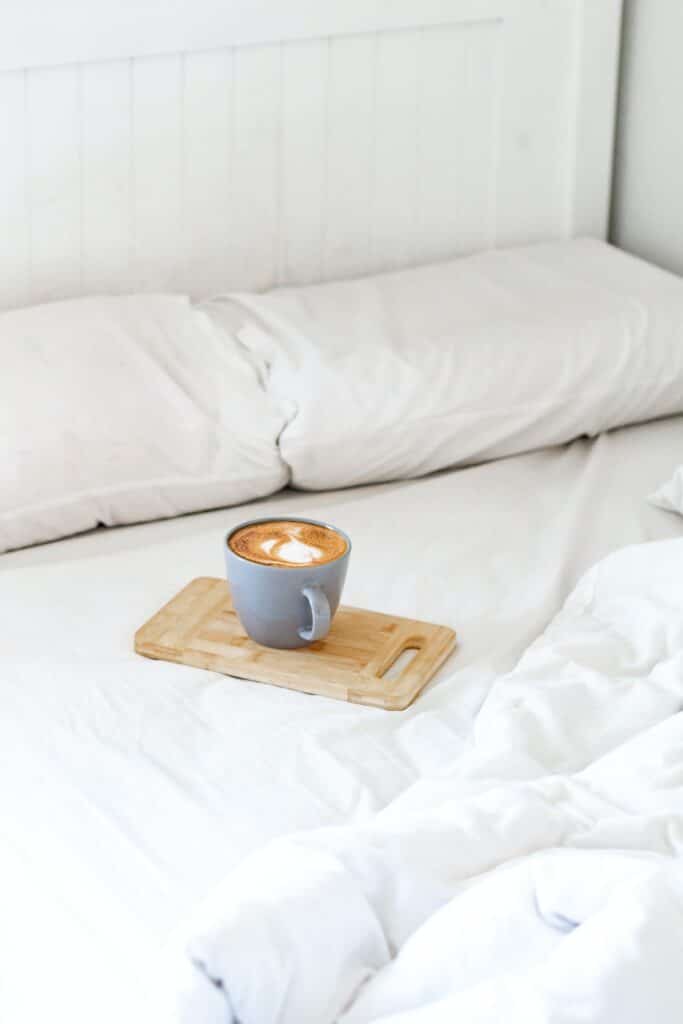 brown ceramic mug on brown wooden chopping board