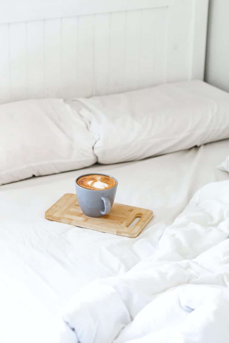 brown ceramic mug on brown wooden chopping board